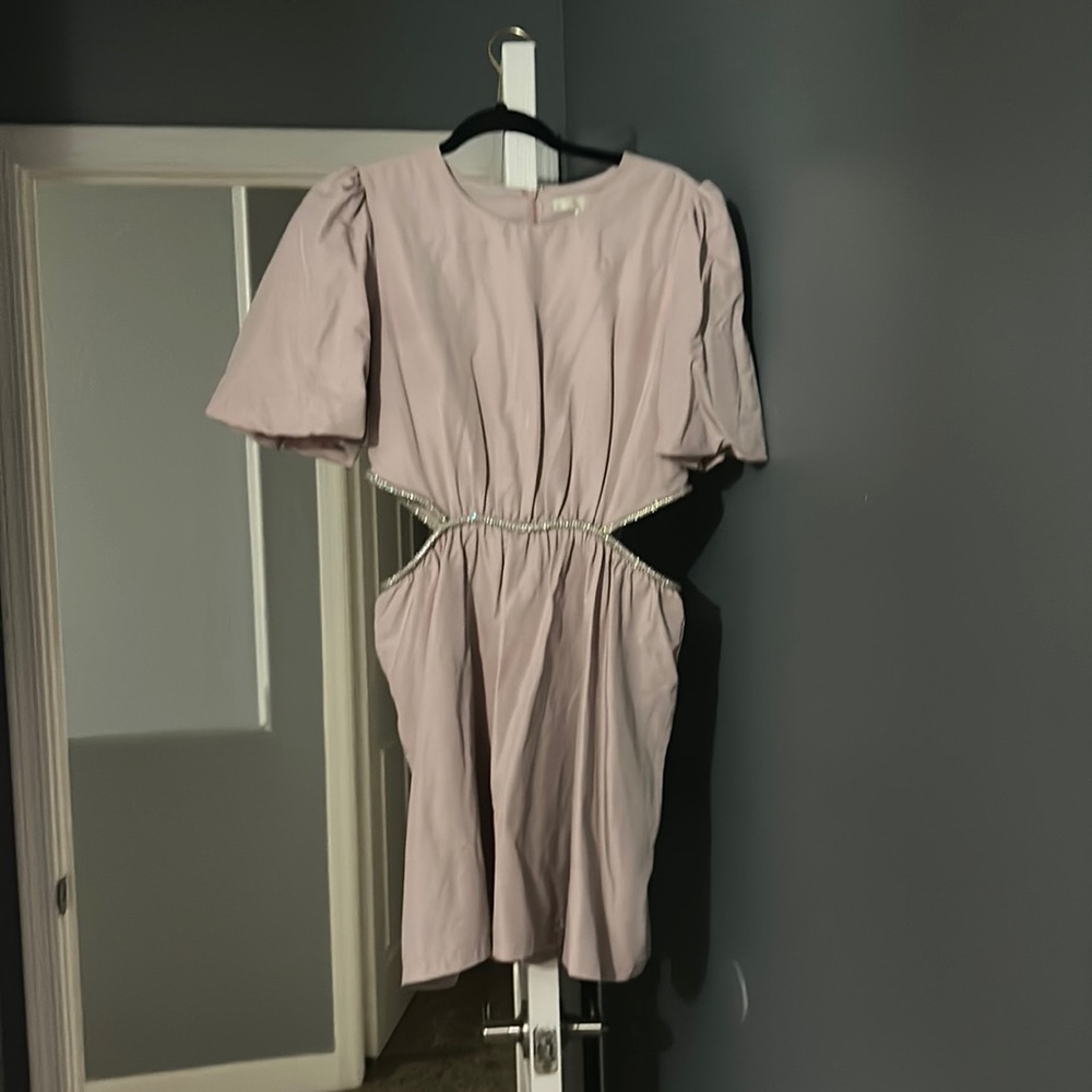 This is a baby pink dress.